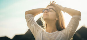 Happy and relieved woman with eyes closed